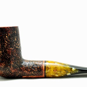 May include: A white ceramic mug with a black handle and the text "But First, Coffee" in a bold, black font. The mug is sitting on a wooden surface. The mug is approximately 4 inches tall.