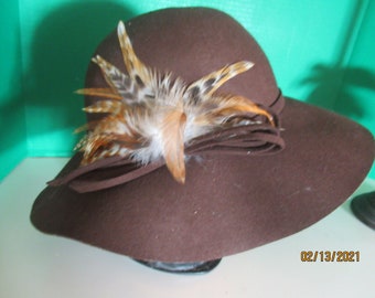 Hat Vintage Brown 100% wool Hat, 2" hat band inside 1" Crown app 6" Brim 5"  24" inside around app 1 size fits all Beautiful Feathers