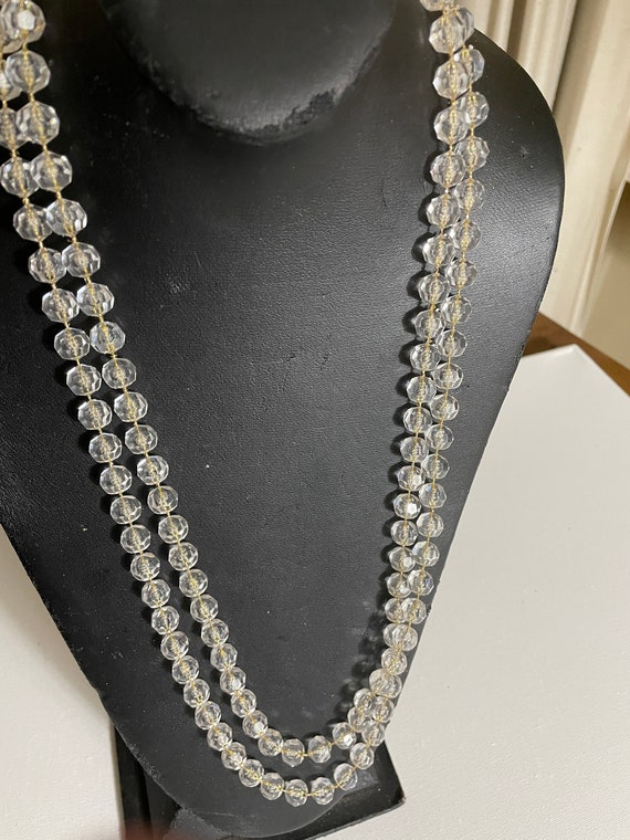 Long Necklace of clear faceted beads with goldtone