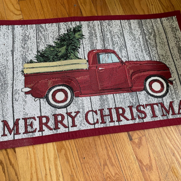 Christmas rug "Merry Christmas" hand woven rug w red binding 30 x 18" Red Truck with Christmas tree in back Rubber backing  cotton weaving