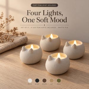 May include: A set of four off-white cat-shaped tealight holders made of matte PLA. Each holder features two small ears and contains a glowing LED tealight. The text reads: CAT TEALIGHT HOLDER, Four Lights, One Soft Mood, SET OF 4 - 4 LED TEALIGHTS INCLUDED - MATTE PLA.