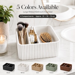 May include: A white ribbed bathroom organizer with 4 compartments, measuring approximately 20 x 16 x 10 cm. The organizer holds makeup brushes, bottles, and a hairbrush. Text reads 5 Colors Available, Large Ribbed Bathroom Organizer.