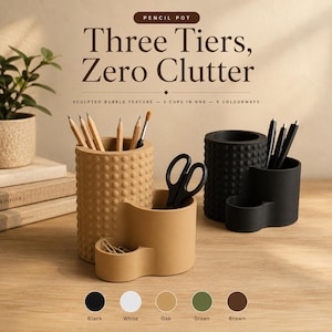 May include: A tan and a black pencil pot, each featuring three tiers and a sculpted bubble texture. The tan pot holds wooden pencils and black scissors, while the black pot holds black pens. Text reads: Pencil Pot, Three Tiers, Zero Clutter.