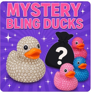 May include: A promotional image with the text "MYSTERY BLING DUCKS" on a purple background. It shows a blinged-out rubber duck, a black bag with a question mark, and three rubber ducks in pink and blue. The ducks have orange beaks.