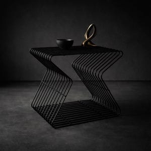 May include: A set of three ceramic mugs with a speckled, matte finish. The mugs are in shades of cream, light grey, and dark grey. Each mug has a simple, minimalist design, ideal for coffee or tea.