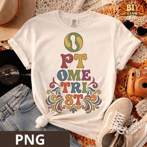May include: Cream-colored t-shirt with the word "OPTOMETRIST" in a colorful, retro font. The design features a groovy, psychedelic style with swirling lines and a vintage aesthetic. The shirt is styled with jeans, sneakers, and a vinyl record.