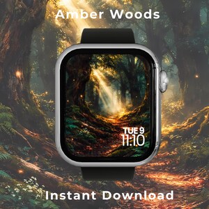 May include: A silver smartwatch with a black silicone band displays a digital forest scene on its screen. The screen shows the text TUE 9 and 11:10. The background features a sunlit woodland path with trees and glowing light particles.
