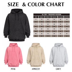 May include: A size and colour chart for washed hoodies. The image shows a black hoodie, and three other hoodies in pink, apricot, and grey. The chart provides measurements in centimetres for various sizes, including length, width, chest, and sleeve dimensions.