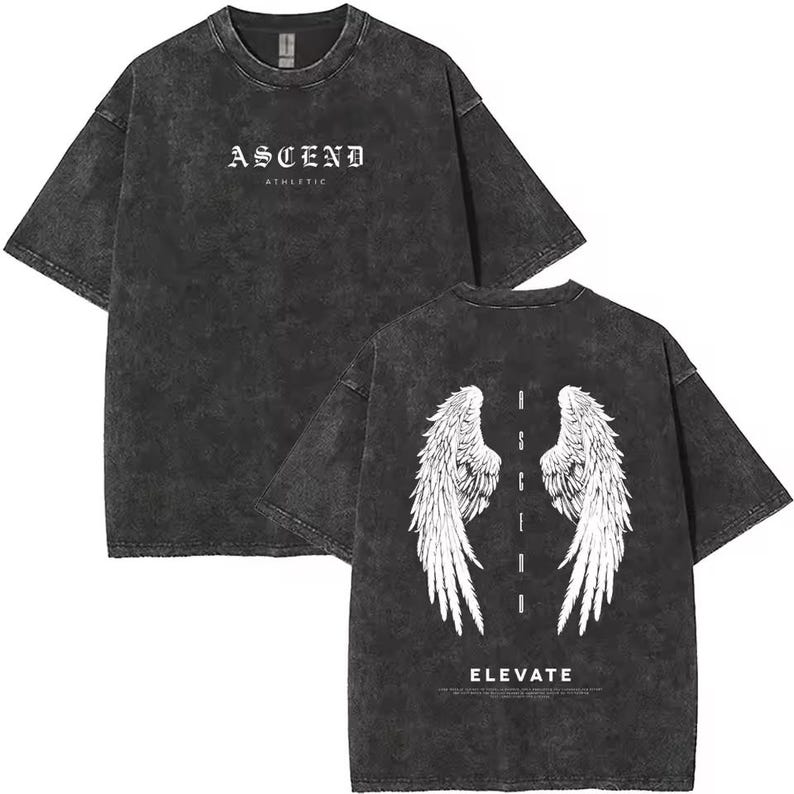 May include: Charcoal grey t-shirt with a worn effect. The front has the word "ASCEND" above "ATHLETIC" in white. The back shows white angel wings and the word "ELEVATE".