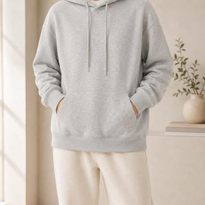 Bluza z kapturem o średniej grubości, wykonana w 100% z bawełny, luźny krój, w stylu ulicznym