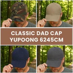 May include: Four classic dad caps in different colors: camouflage, khaki, navy blue, and charcoal gray. The caps are made of a durable material and feature a curved brim. The text "CLASSIC DAD CAP YUPOONG 6245CM" is displayed in the center.