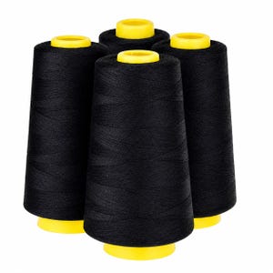May include: Four black thread spools with yellow bases and tops are set against a white backdrop. The thread is tightly wound, and the spools are evenly spaced. The image is well-lit, highlighting the texture of the thread.