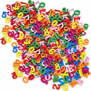 May include: A collection of brightly coloured wooden numbers and letters. The numbers and letters are in a variety of colours, such as red, yellow, green, blue, and pink. The image shows a scattered pile of these educational toys.