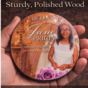 May include: A round, polished wood memorial plaque featuring a portrait of Jane Price. The plaque includes the text "IN LOVING Jane PRICE" and dates "JANUARY 24, 1951 - DECEMBER 6 2023". The top of the plaque reads "Sturdy, Polished Wood".