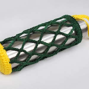 May include: A stainless steel water bottle inside a green crocheted net with yellow accents. The net has a yellow base and a yellow loop for carrying. The bottle is cylindrical and appears to be empty.