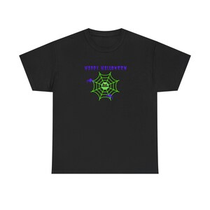 May include: A black short-sleeved t-shirt featuring a graphic print of a bright green spider web with a small black cat face in the centre, two purple spiders, and the purple text "HAPPY HALLOWEEN" positioned above the web design.