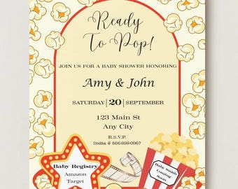 May include: A rectangular baby shower invitation featuring a popcorn pattern border and a red arched frame. Text reads: Ready To Pop! JOIN US FOR A BABY SHOWER HONORING Amy & John SATURDAY 20 SEPTEMBER 123 Main St Any City R.S.V.P. Stella @ 566-898-0967.
