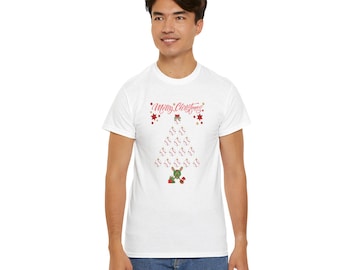 May include: A white short-sleeve t-shirt featuring a graphic of a Christmas tree made of baseballs. The text Merry Christmas is printed in red above the tree, which is topped with a small red star and accented with red stars and baseball bats.