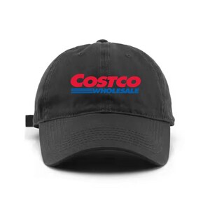 May include: A black baseball cap with the Costco Wholesale logo in red and blue. The hat has a curved brim and an adjustable strap at the back. The cap is made of a durable fabric.
