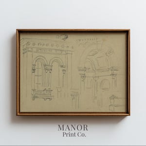 May include: A framed pencil sketch of architectural elements, including arches, columns, and detailed building facades. The artwork is in a wooden frame and features the text "MANOR Print Co." at the bottom.