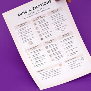 May include: A white paper titled "ADHD & EMOTIONS CHEAT SHEET" with text and graphics, held against a purple background. The sheet lists reasons why emotions feel big, common emotional triggers, and what they look like. It also includes in-the-moment tools and long-term strategies.
