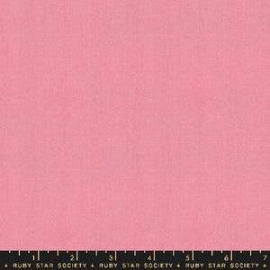 May include: A solid pink fabric with a subtle texture. The fabric is a light pink colour and has a slightly grainy appearance.