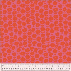 May include: A pink fabric with a repeating pattern of red flowers. The flowers are stylised and have a simple design.