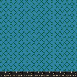 May include: Teal fabric featuring a repeating pattern of small, dark green squares in a grid. The fabric has a textured look and consistent colour. A ruler at the bottom displays the text "RUBY STAR SOCIETY".