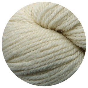 May include: A skein of natural white yarn, made from wool. The yarn is soft and fluffy, and it is perfect for knitting or crocheting.