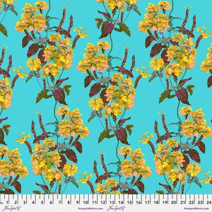 May include: A turquoise blue fabric with a repeating pattern of yellow and pink flowers with green leaves and brown stems. The fabric has a ruler with inches marked on it.