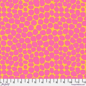May include: A yellow fabric with a pink polka dot pattern. The dots are irregular in shape and size.