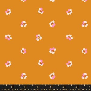 May include: A seamless pattern featuring pink and white flowers on a mustard yellow background. The flowers are arranged in a repeating pattern.