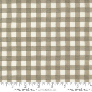 May include: A white and brown gingham fabric with a subtle texture. The fabric is shown with a ruler for scale.