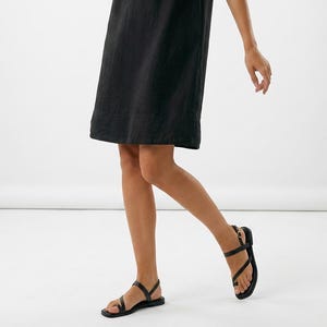 May include: A rustic wooden sign with the text "Welcome to our home" in white lettering. The sign has a distressed finish and a simple, inviting design, suitable for a front porch or entryway.