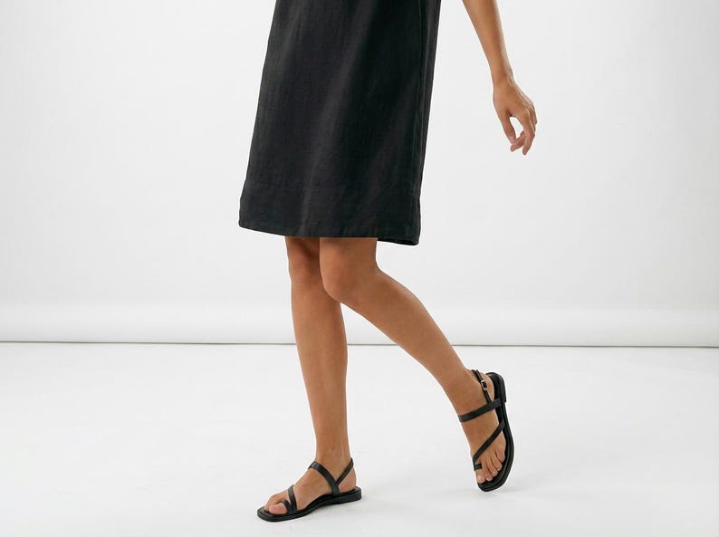 May include: A rustic wooden sign with the text "Welcome to our home" in white lettering. The sign has a distressed finish and a simple, inviting design, suitable for a front porch or entryway.