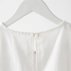 May include: A trio of ceramic mugs with a speckled, matte finish in cream, light grey, and dark grey. Each mug features a simple, minimalist design, ideal for tea or coffee.