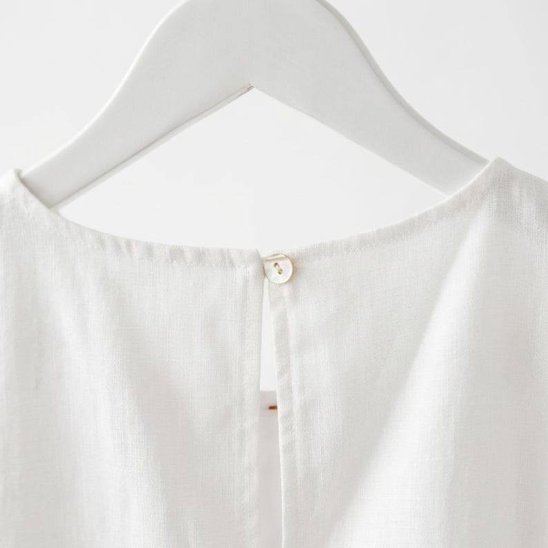 May include: A trio of ceramic mugs with a speckled, matte finish in cream, light grey, and dark grey. Each mug features a simple, minimalist design, ideal for tea or coffee.