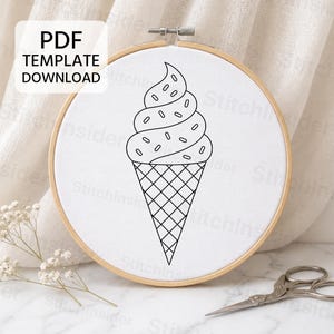 May include: A circular wooden embroidery hoop containing white fabric with a black line art design of a soft serve ice cream cone with sprinkles. The image includes the text PDF TEMPLATE DOWNLOAD in a white box in the upper left corner.