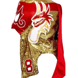 May include: A handmade wooden sign with the text "Welcome" in a whimsical font. The sign is painted white with a distressed finish, and features a decorative floral design in shades of pink and green. It measures approximately 12 inches wide.