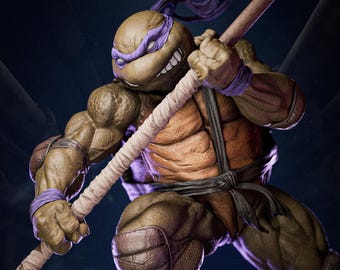 May include: A detailed figurine of a Teenage Mutant Ninja Turtle, Donatello, in a dynamic pose. The figure is predominantly brown and orange, with purple accents on the mask and armbands. He is holding a bo staff, with a detailed texture and muscular build.