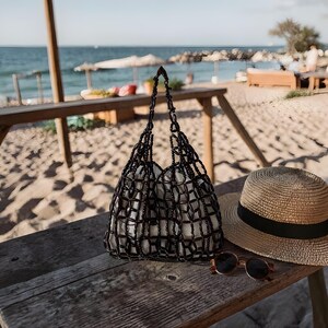 Handcrafted woven string carryall with wooden bead charm