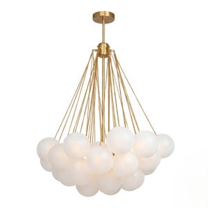May include: A contemporary chandelier with multiple white glass spheres hanging from gold-toned chains and a central stem. The ceiling-mounted light fixture provides ambient illumination for a room.