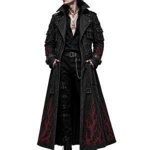 May include: A long black denim trench coat featuring a dark red flame pattern along the lower hem and sleeves, multiple utility pockets on the chest and shoulders, silver-toned metal buckles, straps, and a structured collar over a black shirt.