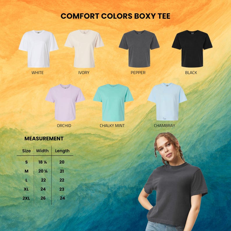 May include: A collection of Comfort Colors boxy t-shirts in white, ivory, pepper, black, orchid, chalky mint, and chambray. A size chart displays width and length measurements in inches for sizes S through 2XL. A person wears a pepper-colored t-shirt.