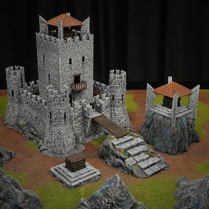 May include: A miniature castle set with grey stone walls, brown wooden bridges, and red-tiled roofs. The set includes a large central tower, smaller turrets, and a separate watchtower on a rocky base, ideal for tabletop gaming.