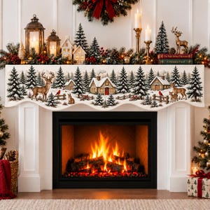 May include: A cream-colored fireplace mantel scarf featuring a printed winter landscape with snow-covered pine trees, rustic cabins, deer, and small animals. The fabric has a scalloped bottom edge and displays a detailed forest scene.