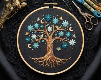 May include: An embroidery hoop containing a black fabric panel with a hand-stitched tree featuring a brown trunk and roots, blue flowers, yellow birds, butterflies, and crescent moons. Includes embroidery floss, two needles, and metal scissors.