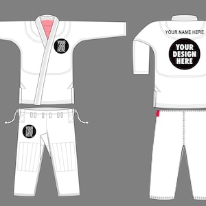 Könnte beinhalten: Weißer Kampfsportanzug, bestehend aus Jacke und Hose. Die Jacke hat ein Wickeldesign mit rosa Innenfutter und einem schwarzen Kreis für ein Logo. Die Hose hat einen Kordelzugbund und verstärkte Knie. Auf dem Rücken der Jacke steht der Text "YOUR DESIGN HERE".