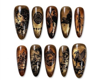 Uñas postizas con diseño de ojo de gato en bronce, silueta de diosa grifo mitológica, uñas de lujo estilo Dark Academia.