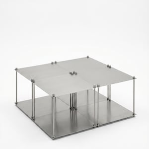 May include: A modern, two-tiered metal display stand with a square base and top. The stand is constructed with four square panels and supported by vertical metal rods and bolts. The overall design is minimalist and industrial.